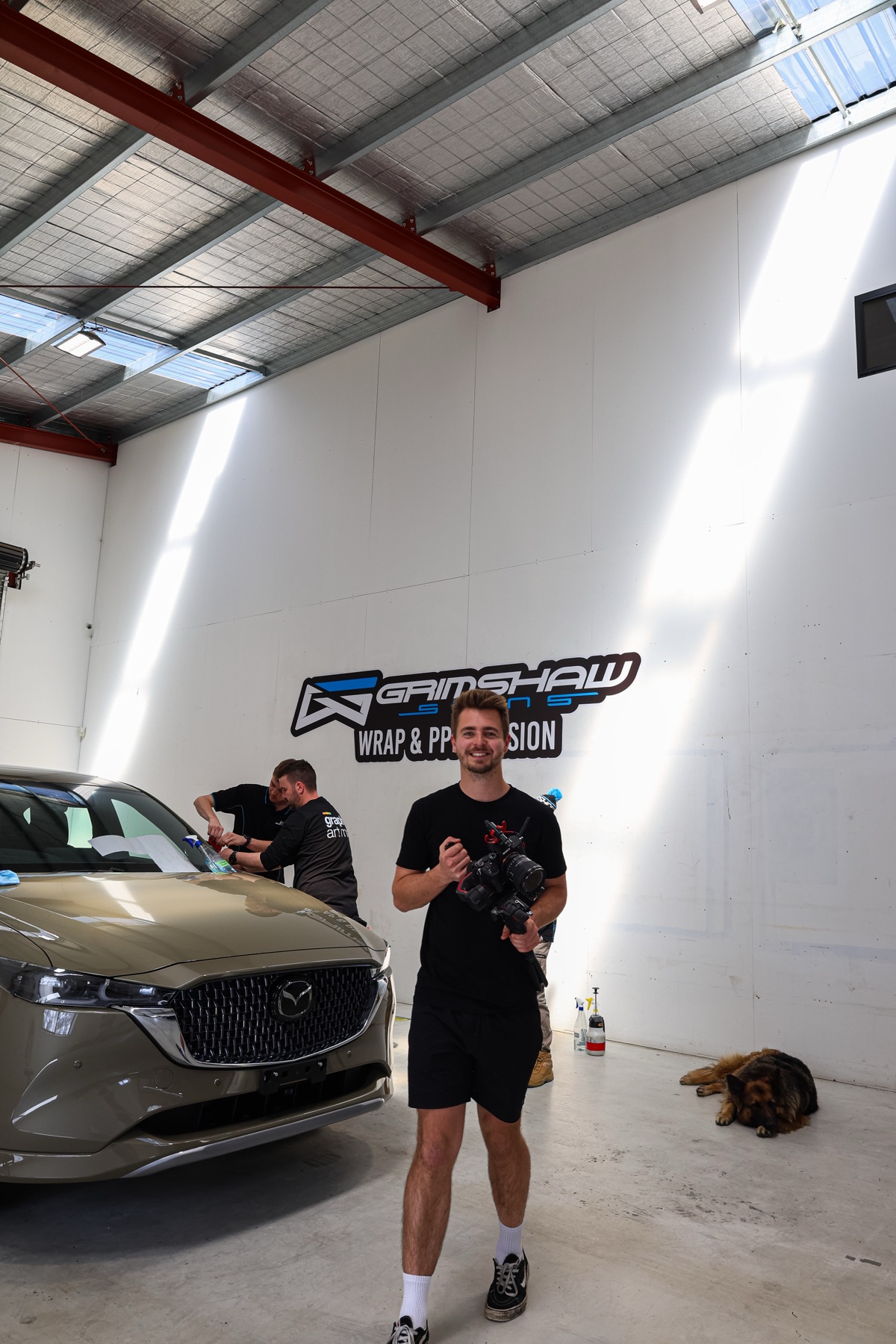 Sam filming a vehicle wrap job